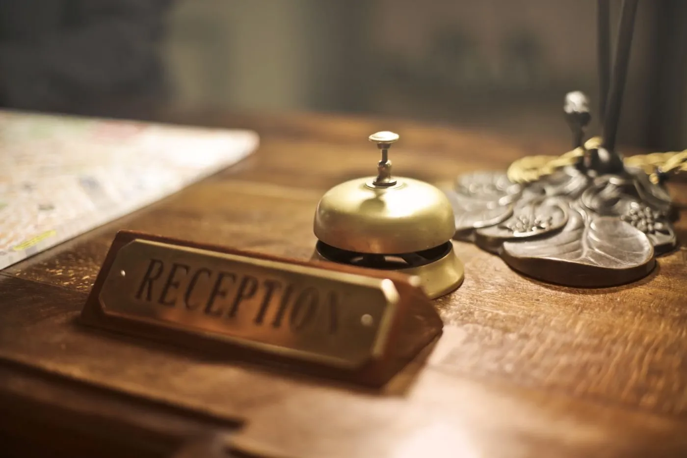 Brass service bell on a hotel reception desk