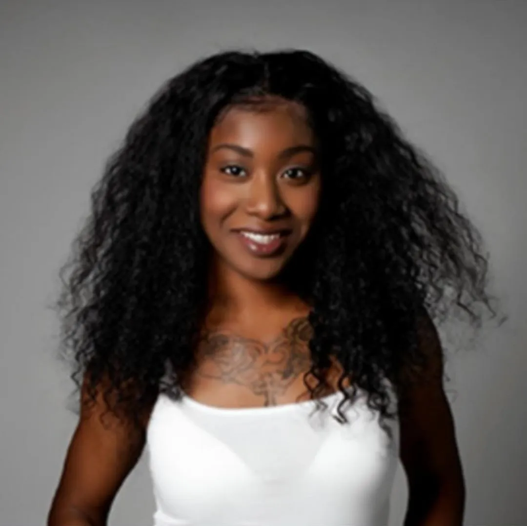 Janelle King, West Palm Beach hair and makeup artist, smiling in a studio portrait